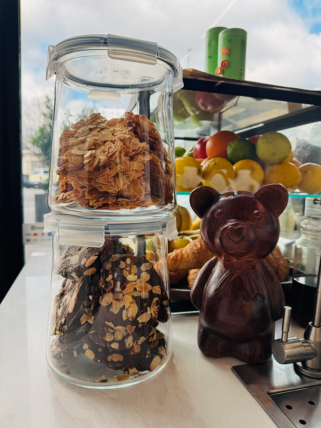 Jars of house-made cookies beside the tip jar on the counter.